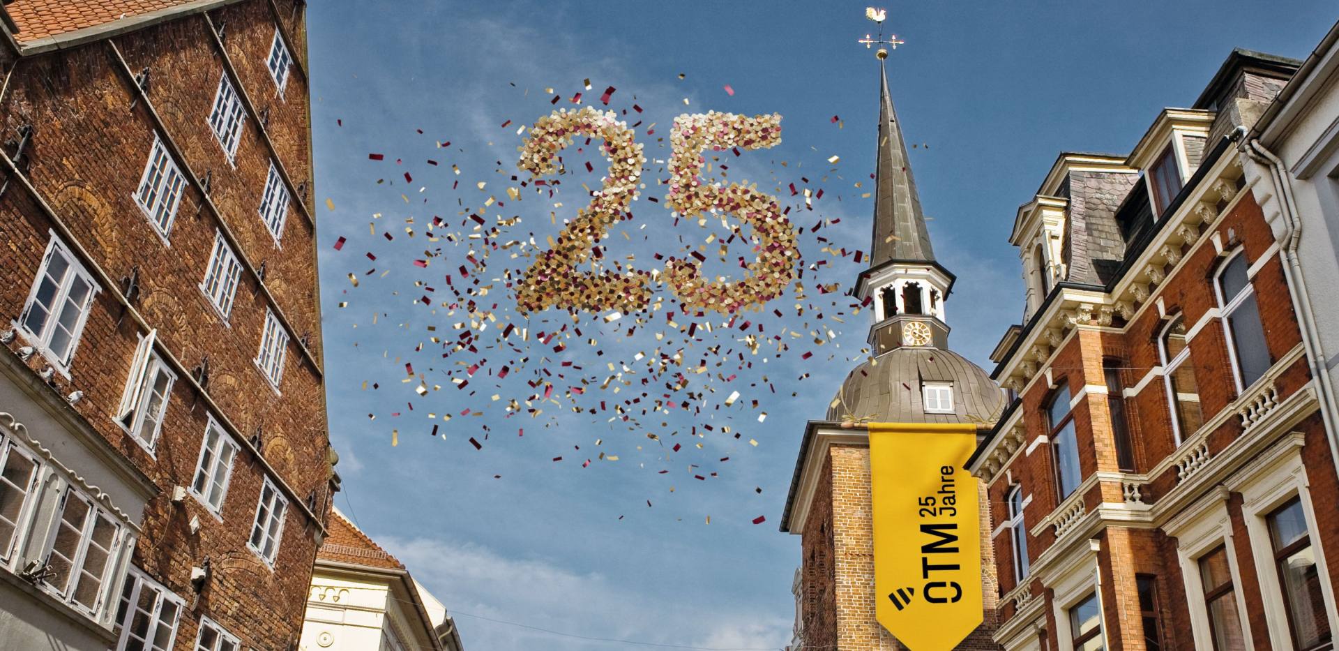 Der Lappan mit einer Banderole, dem Jubil&auml;umslogo und der Zahl 25 aus Konfetti. 