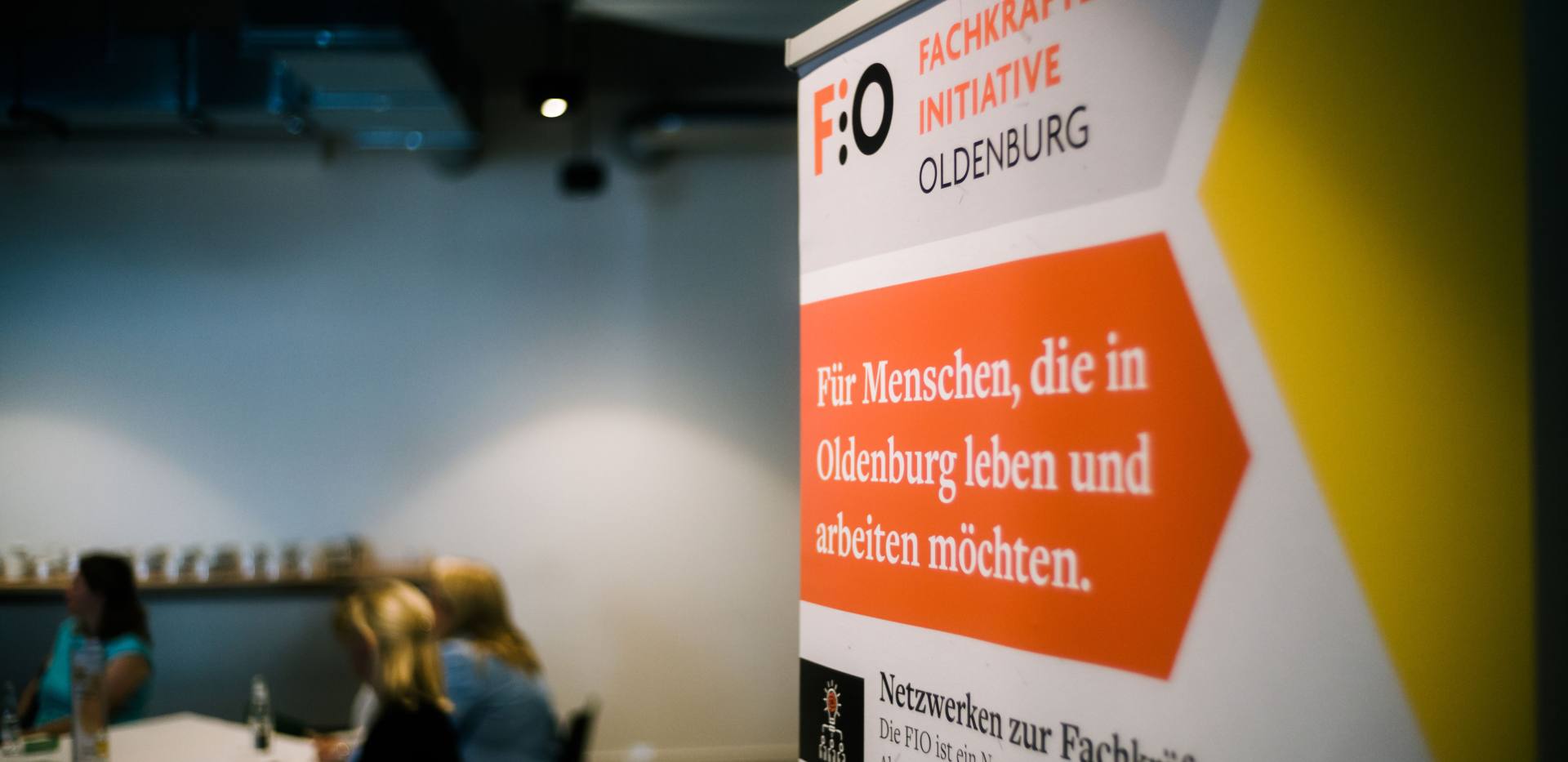 Banner der Fachkräfte-Initiative Oldenburg bei einer Veranstaltung Banner der Fachkräfte-Initiative Oldenburg bei einer Veranstaltung